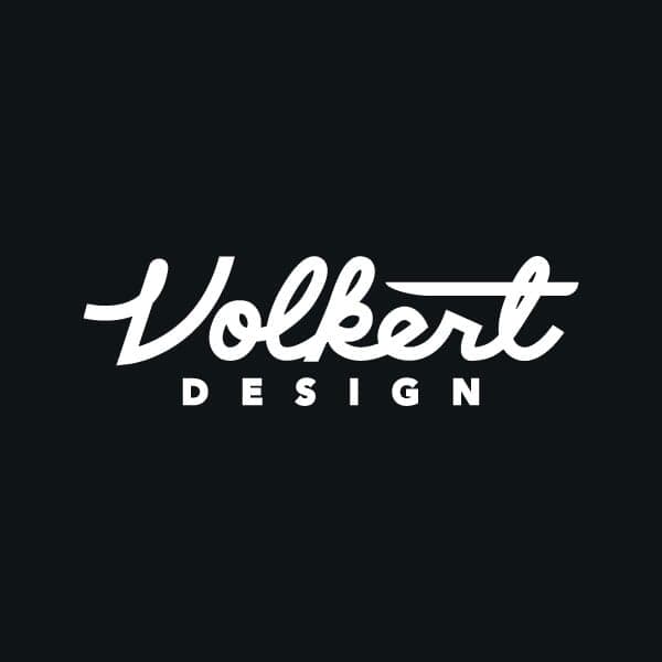 Volkert Design v2 | Nick Volkert Volkert Design streamline script in white on brand red.,Alternate looks for fills for the main Volkert Design script.,Volkert Design script in a variety of flag colors.,Volkert Design script in a variety of solid color pennants.,Volkert Design script in a waving single black pennant.,Volkert Design script in a waving gray pennant.,Volkert Design blackletter V variations.,Volkert Design favicon designs.