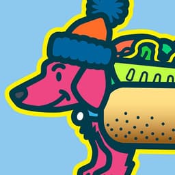 Da Chicago Mustard Dog | Nick Volkert A dachshund smiles while wearing a stocking cap and Chicago style hot dog costume.