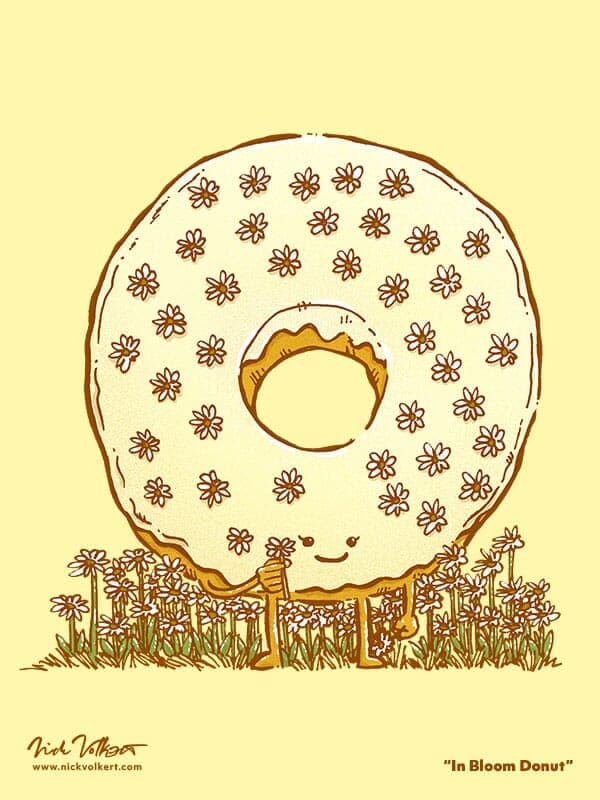 In Bloom Donut | Nick Volkert A yellow iced donut with sugary flower for decorations in Spring with a little daisy in it's hands!