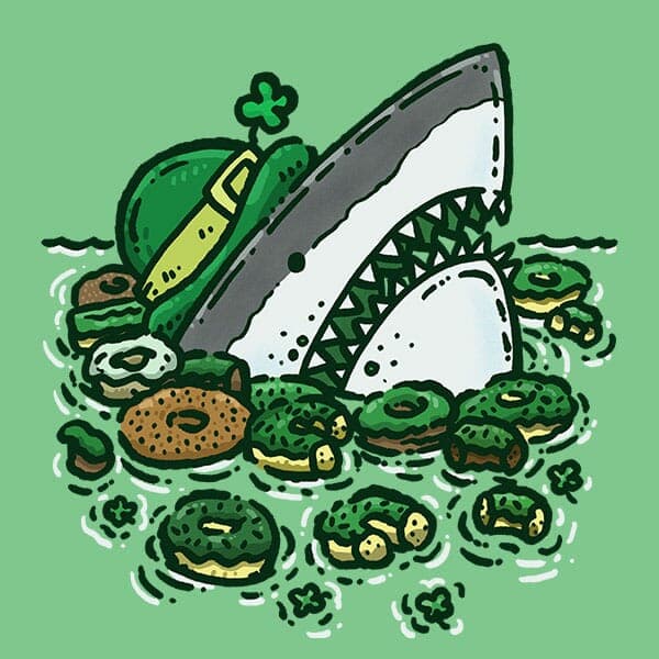 St Patricks Donuts Shark | Nick Volkert A shark all dressed up for St Patricks Day pops out of the water surrounded by a gaggle of St Patricks Day themed donuts!